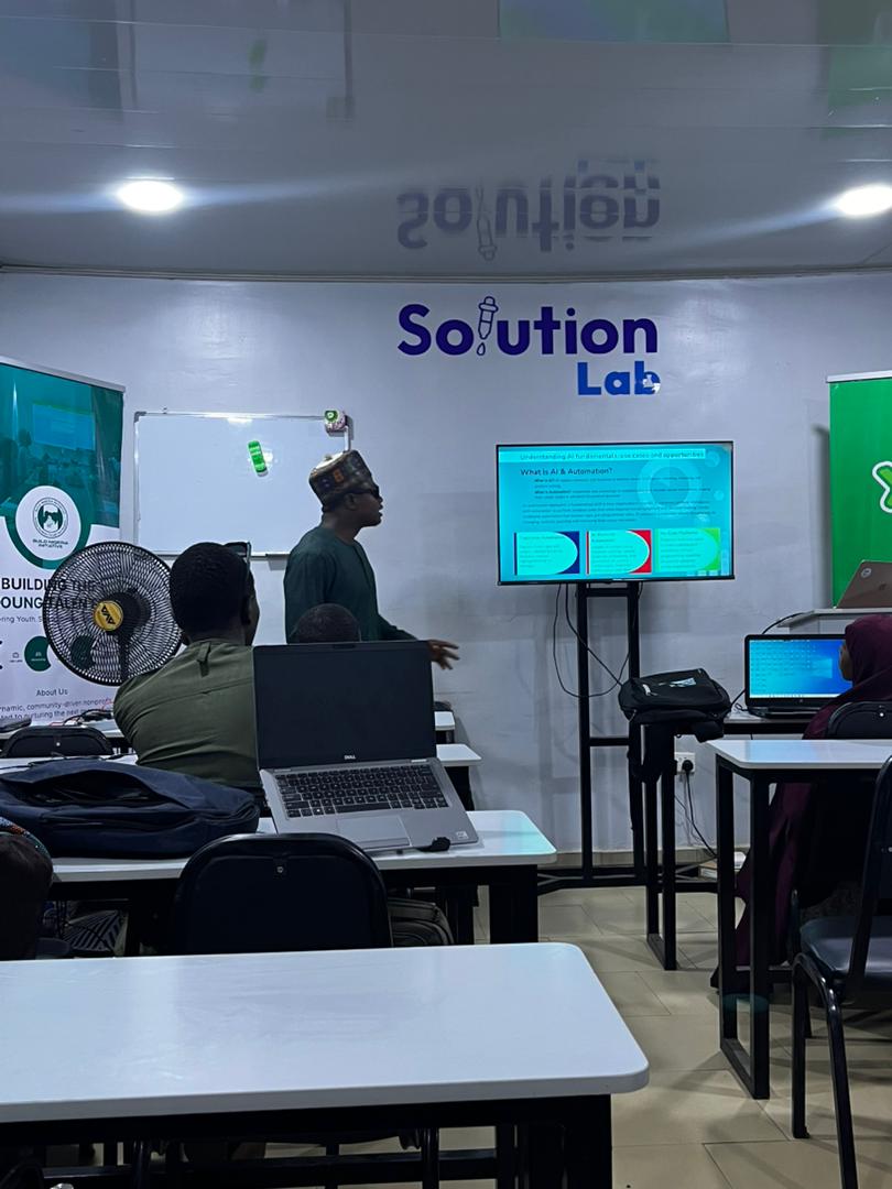 Participants working on group automation projects during the training